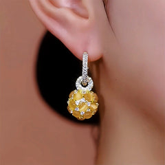 Model showcasing the dangle and style of the 14K Gold-Plated Diamond Cat's Eye Ball Earrings