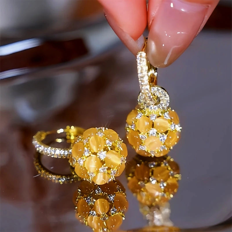 Angled view of the 14K Gold-Plated Diamond Cat's Eye Ball Earrings