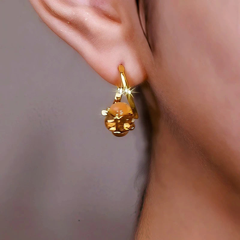 Close-up detail of the sparkling zircons and plating on the Brown Cat's Eye Earrings