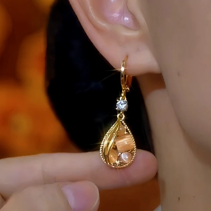 Close-up detail of the sparkling zircons and plating on the Cat's Eye Water Drop Earrings