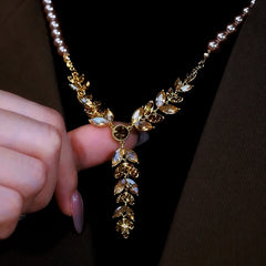 14K Gold-Plated Diamond Cat's Eye Wheat Pearl Sweater Necklace worn to showcase its length and pendant detail