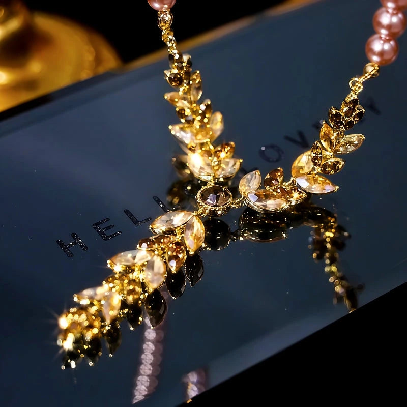 Close-up of the pendant and clasp on the Pearl Sweater Necklace