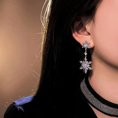 Close-up detail of the sparkling zircons and plating on the Double Snowflake Earrings