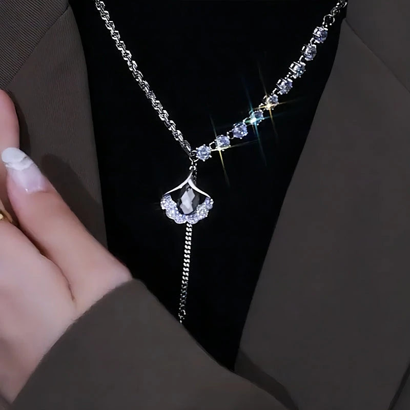 Close-up of the pendant and clasp on the Ginkgo Leaf Necklace