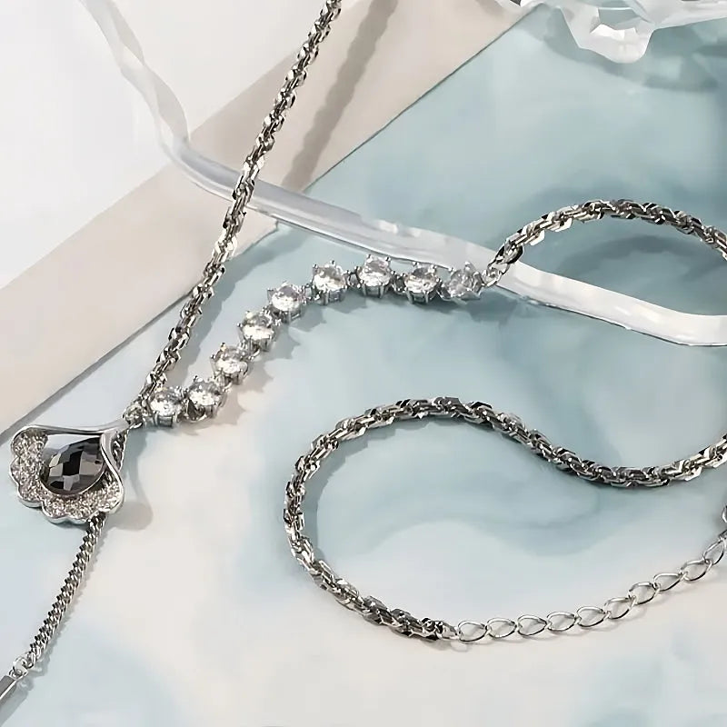 Detailed view of the 14K Gold-Plated Diamond Crystal Ginkgo Leaf Necklace chain and pendant