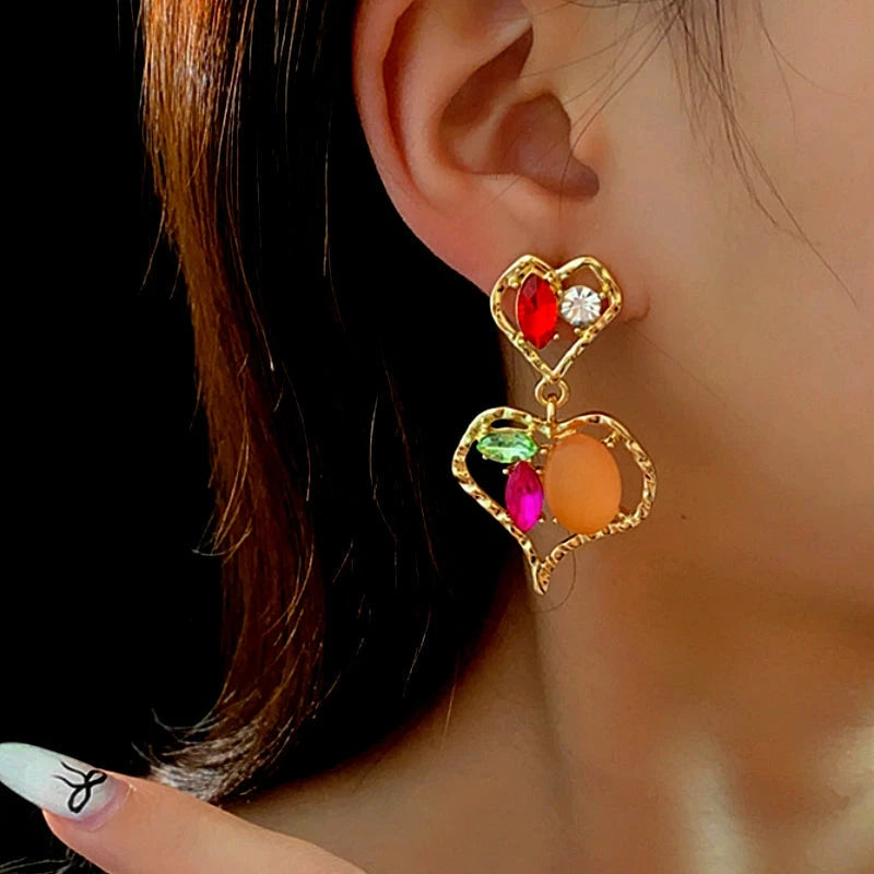 Angled view of the 14K Gold-Plated Diamond Double-Heart Earrings