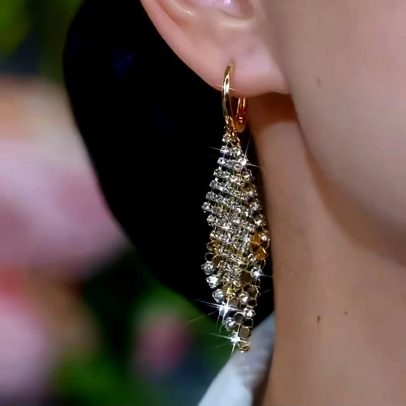 Model showcasing the dangle and style of the 14K Gold-Plated Diamond Double-Layer Diamond Earrings