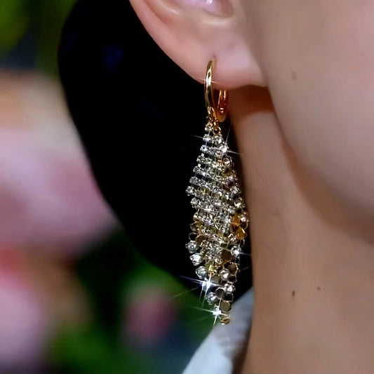 Model showcasing the dangle and style of the 14K Gold-Plated Diamond Double-Layer Diamond Earrings
