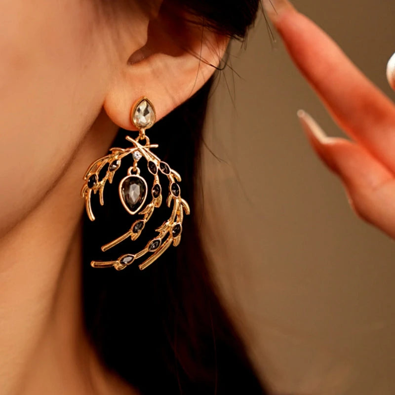 Close-up detail of the sparkling zircons and plating on the Diamond Feather Earrings
