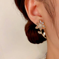 Close-up detail of the sparkling zircons and plating on the Golden Flower Earrings