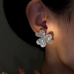 Close-up detail of the sparkling zircons and plating on the Silver Flower Earrings