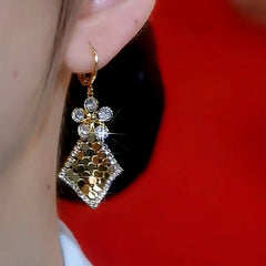 Close-up detail of the sparkling zircons and plating on the Sequin Tassel Earrings