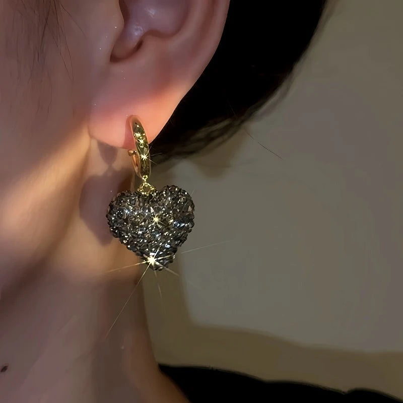 Close-up detail of the sparkling zircons and plating on the Black Heart Earrings