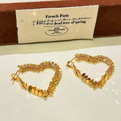 Angled view of the 14K Gold-Plated Diamond Heart Earrings