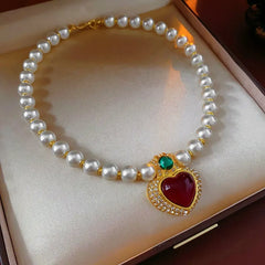 Detailed view of the 14K Gold-Plated Diamond Heart Pearl Necklace chain and pendant