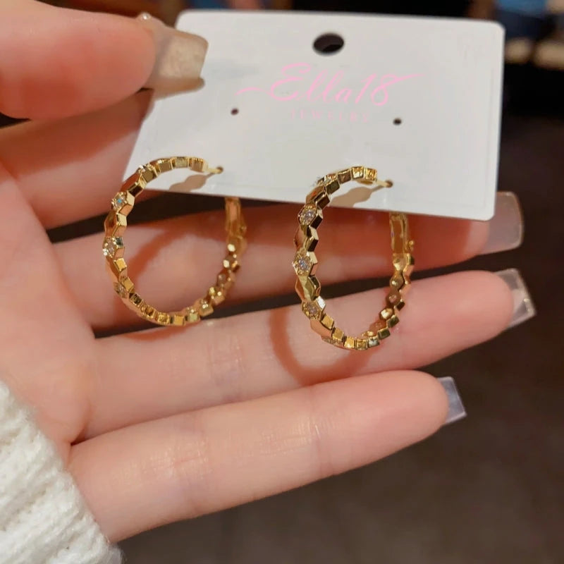 Close-up detail of the sparkling zircons and plating on the Classic Gold Hoops