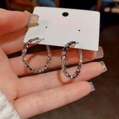 Angled view of the 14K Gold-Plated Diamond Hoop Earrings