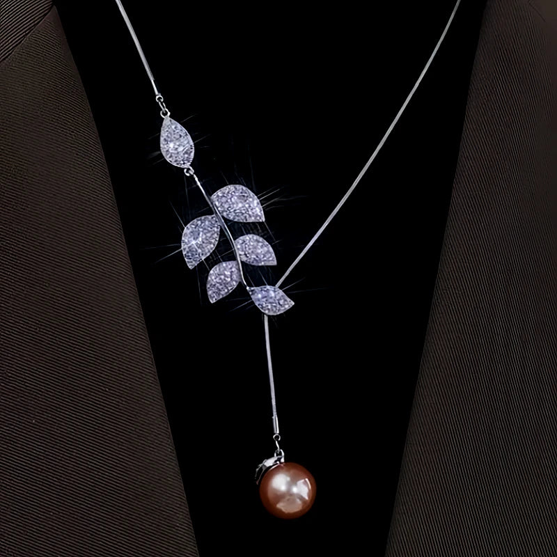 Close-up of the pendant and clasp on the Leaf Pearl Necklace