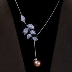 Close-up of the pendant and clasp on the Leaf Pearl Necklace