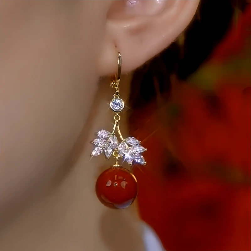 Close-up detail of the sparkling zircons and plating on the Threader Earrings