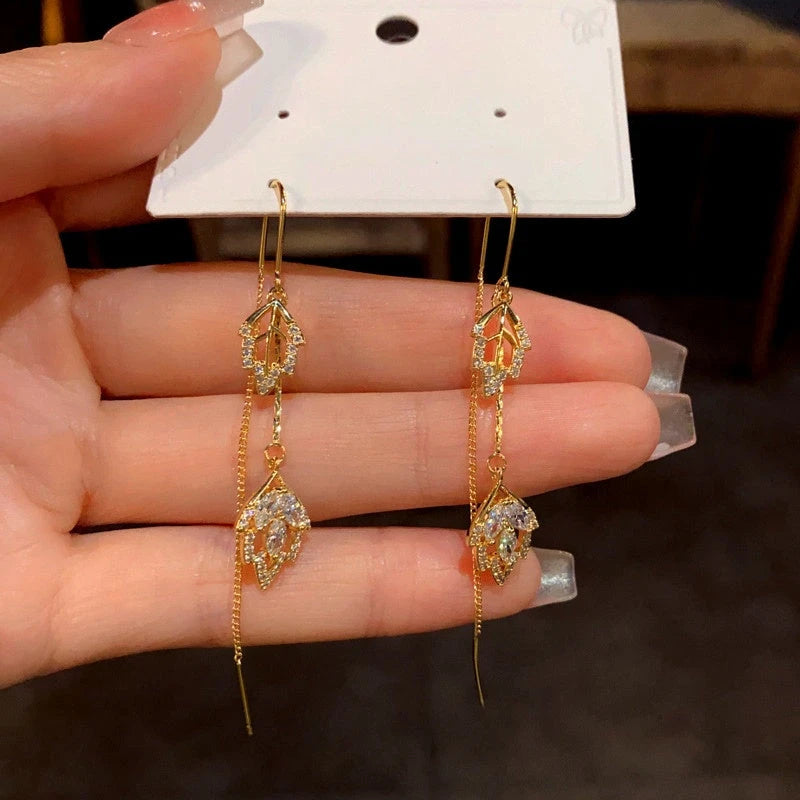 Close-up detail of the sparkling zircons and plating on the Tassel Threader Earrings