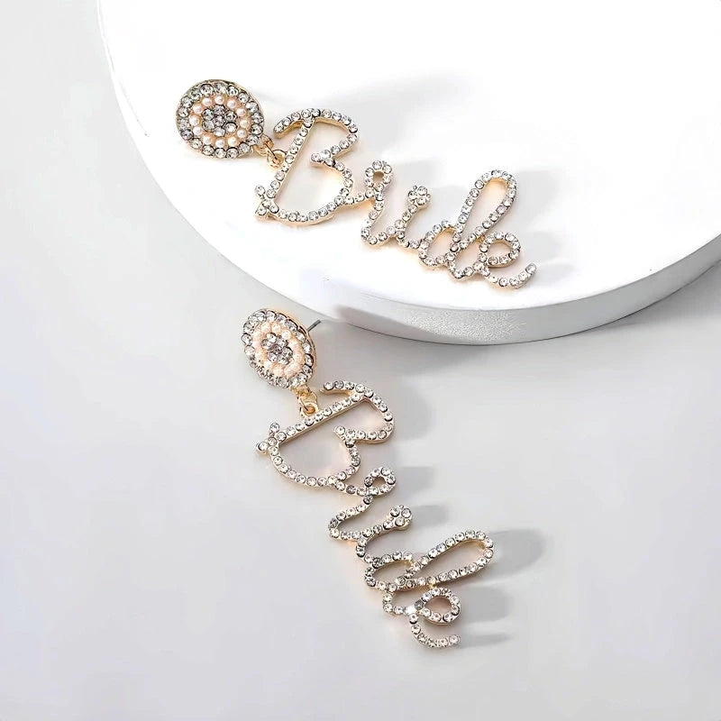 Angled view of the 14K Gold-Plated Diamond Letter Tassel Earrings