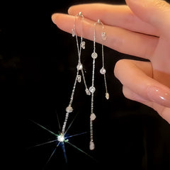 Angled view of the 14K Gold-Plated Diamond Long Tassel Earrings