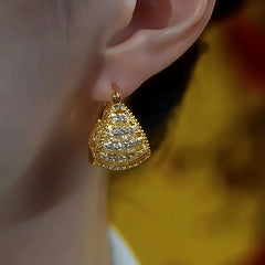 Model showcasing the dangle and style of the 14K Gold-Plated Diamond Mesh Earrings