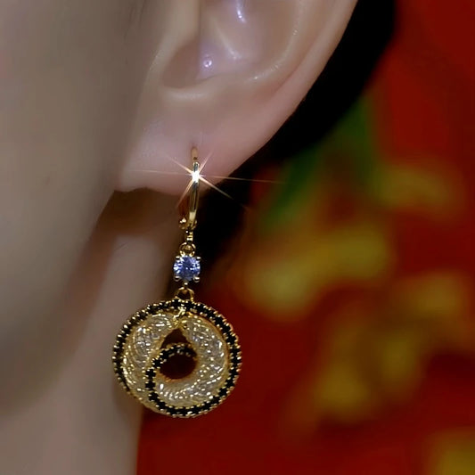 Model showcasing the dangle and style of the 14K Gold-Plated Diamond Mesh Hoop Earrings