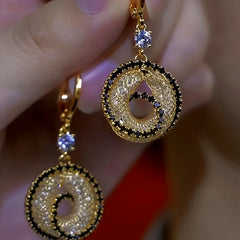 Close-up detail of the sparkling zircons and plating on the Mesh Hoop Earrings