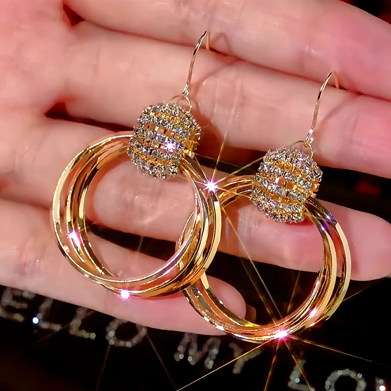 Angled view of the 14K Gold-Plated Diamond Multi-Layer Hoop Earrings