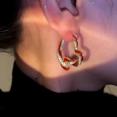 Close-up detail of the sparkling zircons and plating on the Heart-Design Earrings