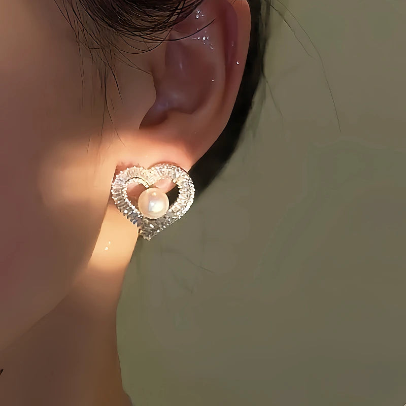 Close-up detail of the sparkling zircons and plating on the Heart Stud Earrings