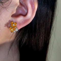 Close-up detail of the sparkling zircons and plating on the Osmanthus Stud Earrings