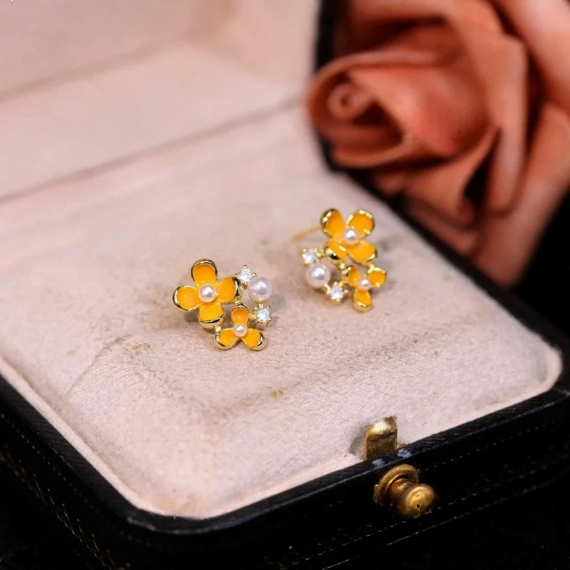 Angled view of the 14K Gold-Plated Diamond Pearl Osmanthus Stud Earrings