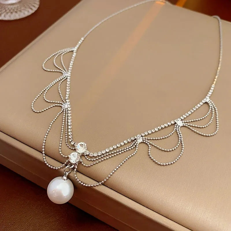 14K Gold-Plated Diamond Pearl Tassel Hollow Necklace worn to showcase its length and pendant detail