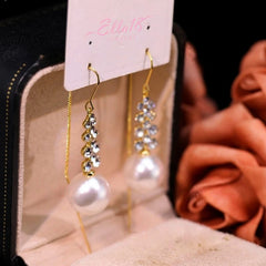 Angled view of the 14K Gold-Plated Diamond Pearl Threader Earrings