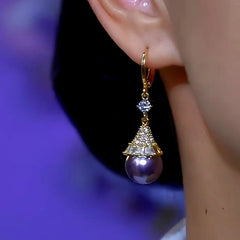Close-up detail of the sparkling zircons and plating on the Purple Pearl Earrings