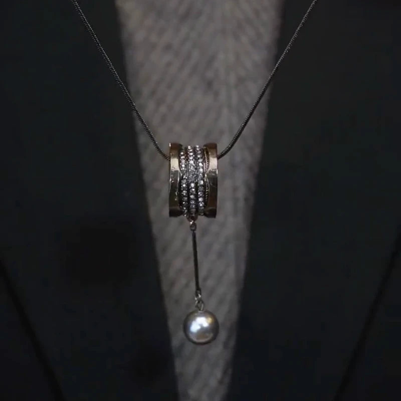 Close-up of the pendant and clasp on the Long Pearl Necklace