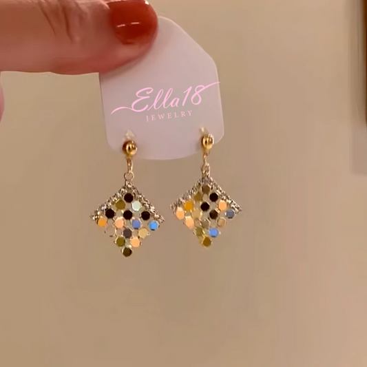 Model showcasing the dangle and style of the 14K Gold-Plated Diamond Sequined Earrings