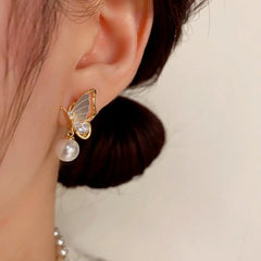 Close-up detail of the sparkling zircons and plating on the Shell Butterfly Earrings