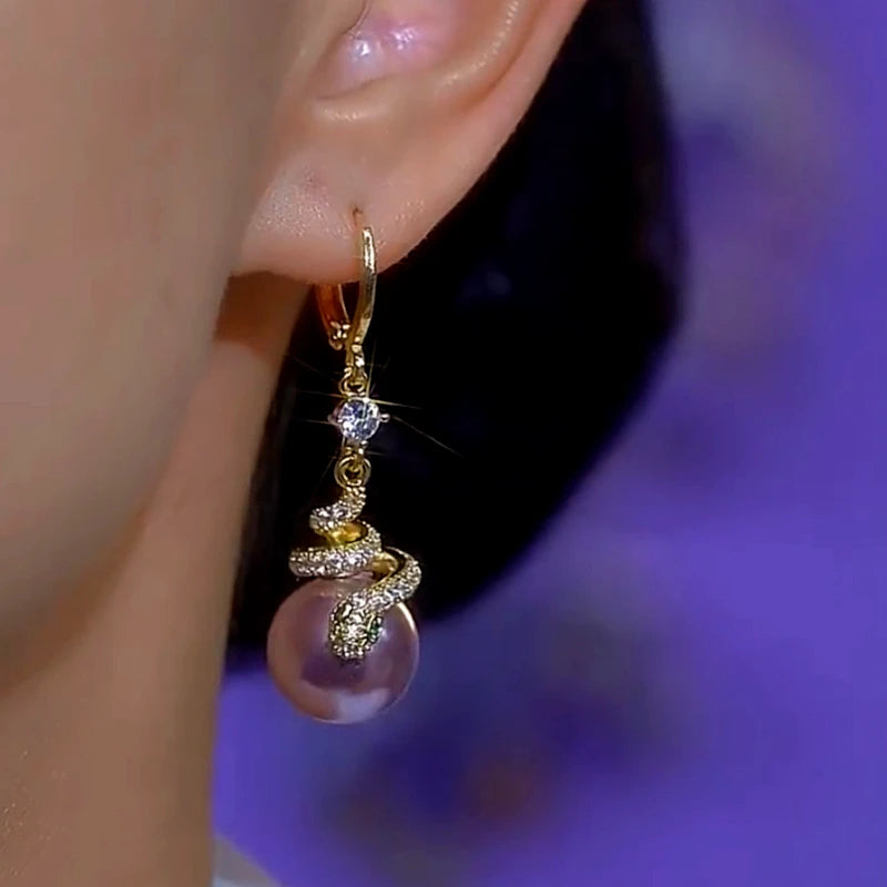 Close-up detail of the sparkling zircons and plating on the Snake Pearl Earrings