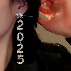 Model showcasing the dangle and style of the 14K Gold-Plated Diamond Snowflake 2025 Digital Earrings