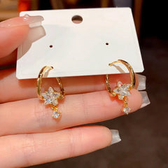 Close-up detail of the sparkling zircons and plating on the Gold Star Earrings