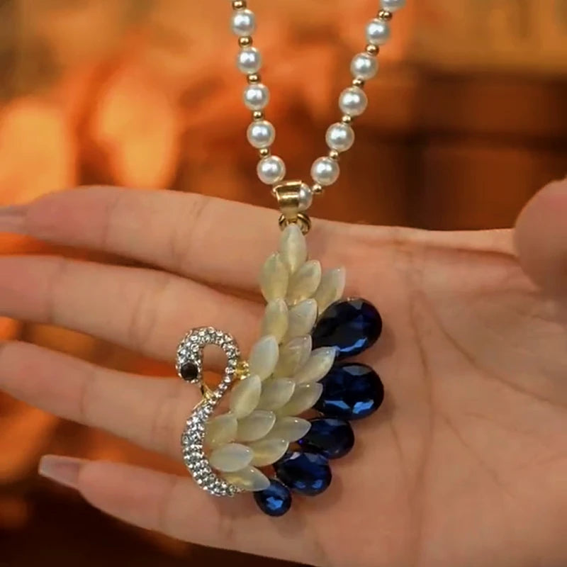 14K Gold-Plated Diamond Swan Crystal Necklace worn to showcase its length and pendant detail