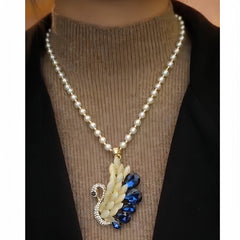 Close-up of the pendant and clasp on the Swan Necklace