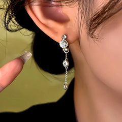 Close-up detail of the sparkling zircons and plating on the Silver Tassel Earrings