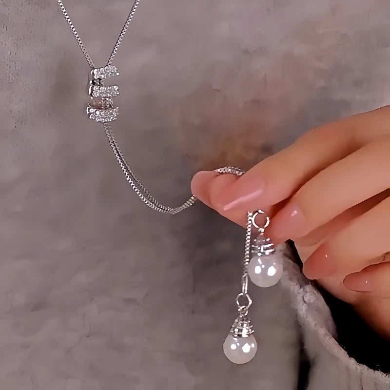 Close-up of the pendant and clasp on the Tassel Sweater Necklace