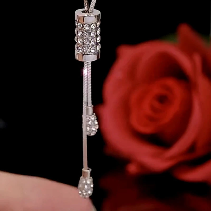 Close-up of the pendant and clasp on the Tassel Sweater Necklace