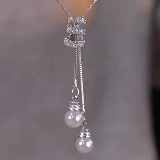 14K Gold-Plated Diamond Tassel Sweater Chain Necklace worn to showcase its length and pendant detail